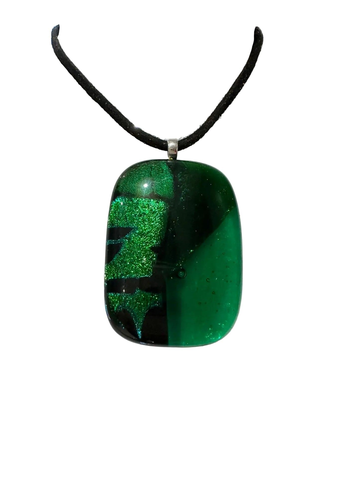 Green and black pendant on a mannequin with a blurred background