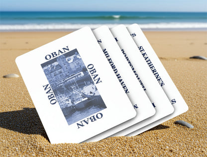 Set of playing cards with 'Oban' and 'St Katherines' on a beach
