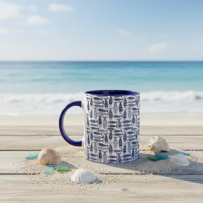 Mug with fish pattern on a beach setting