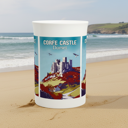 Candle with a design of Corfe Castle, Dorset on a white background