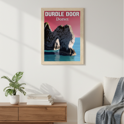 Framed artwork of Durdle Door, Dorset on a wall in a living room.