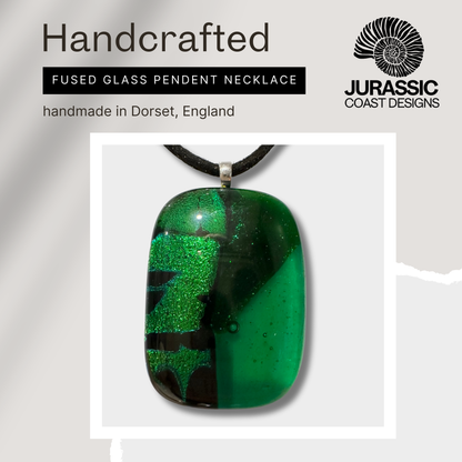 Handcrafted fused glass pendant necklace with green and black design, made in Dorset, England, by Jurassic Coast Designs.