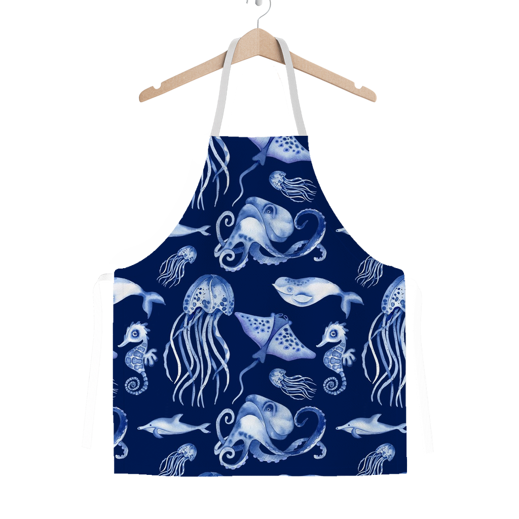 Navy blue apron with white sea creature pattern on a white background