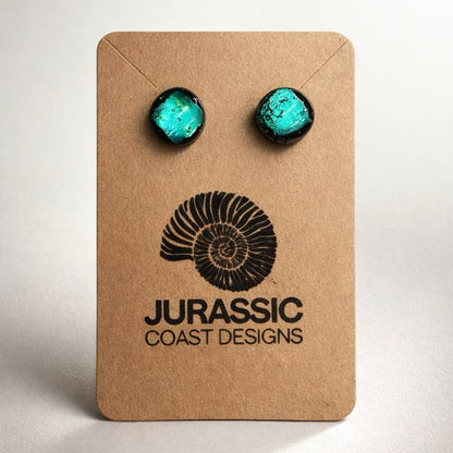 Turquoise earrings on a 'Jurassic Coast Designs' branded card against a white background