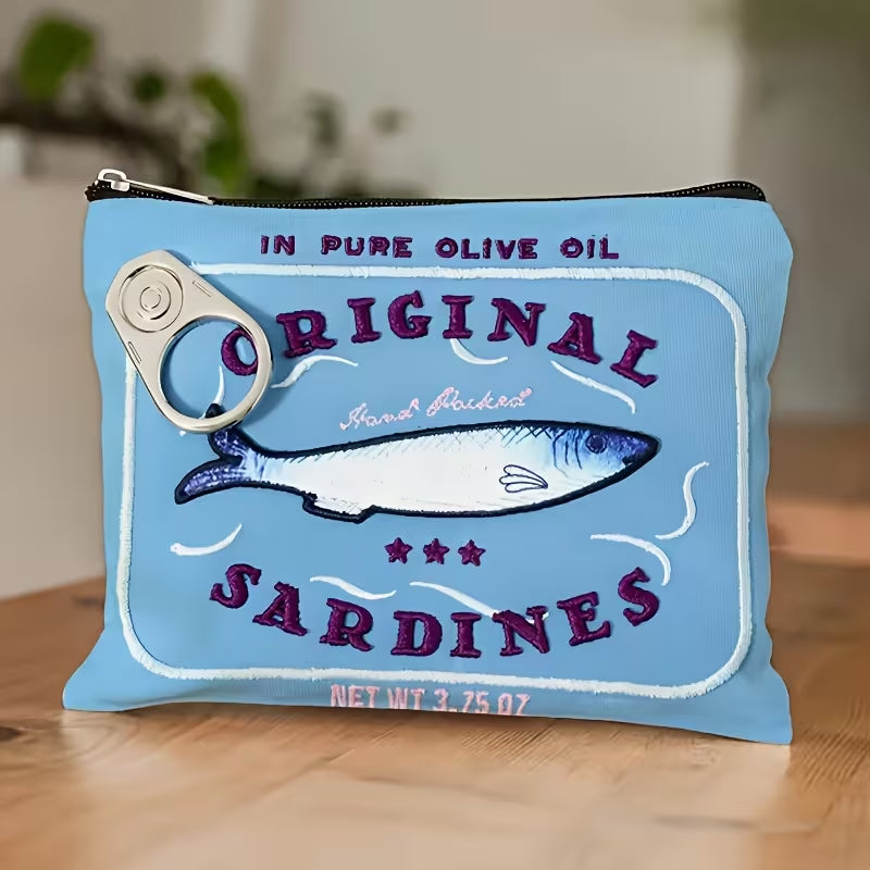 Pouch designed to look like a vintage sardine can label on a wooden surface.