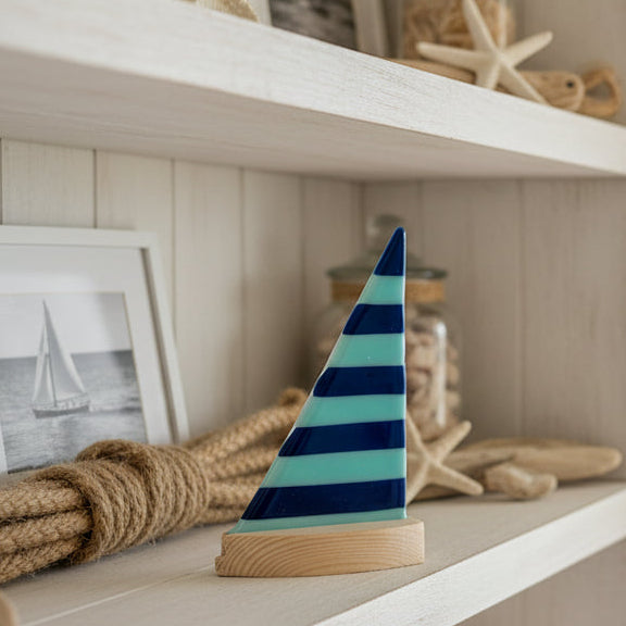 glass sailboat in a nautical setting
