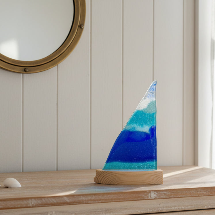 Decorative object with blue and white design on a white surface