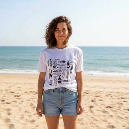 White t-shirt with black fish pattern and 'Jurassic Coast Designs' text on a white background